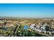 Expansive aerial shot of a luxurious residential area featuring lush landscaping and golf course at 6142 E Alta Hacienda Dr, Scottsdale, AZ 85251