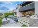 This is a stunning outdoor space with a grill, spa, lounge area, and a beautifully manicured lawn at 6142 E Alta Hacienda Dr, Scottsdale, AZ 85251