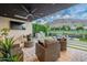 This outdoor living area boasts a modern grill, cozy seating, and a view of the nearby mountain at 6142 E Alta Hacienda Dr, Scottsdale, AZ 85251