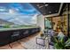 This is an inviting balcony featuring comfortable seating and offering scenic views of the golf course and mountains at 6142 E Alta Hacienda Dr, Scottsdale, AZ 85251