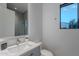 This bathroom boasts a modern vanity, a sleek frameless mirror, and a glass-enclosed shower at 6142 E Alta Hacienda Dr, Scottsdale, AZ 85251