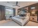 Serene bedroom with a modern aesthetic, featuring a dedicated workspace and elegant decor at 6142 E Alta Hacienda Dr, Scottsdale, AZ 85251