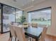 This dining area features a view of the mountains, a large window and hardwood floors with an open concept layout at 6142 E Alta Hacienda Dr, Scottsdale, AZ 85251