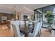 The dining area has hardwood floors and flows into the kitchen and living room, with an adjacent outdoor covered patio at 6142 E Alta Hacienda Dr, Scottsdale, AZ 85251