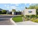 Community entrance with manicured landscaping, stone walls, and gated entry at 6142 E Alta Hacienda Dr, Scottsdale, AZ 85251