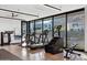 Bright gym with floor-to-ceiling windows, treadmills, and weight training machines at 6142 E Alta Hacienda Dr, Scottsdale, AZ 85251