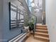 Hallway featuring a staircase, bench seating, and stylish decor at 6142 E Alta Hacienda Dr, Scottsdale, AZ 85251