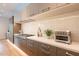 Well-appointed kitchen featuring stainless steel appliances, quartz countertops, and stylish cabinetry at 6142 E Alta Hacienda Dr, Scottsdale, AZ 85251