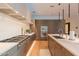 Gourmet kitchen featuring stainless steel appliances, custom cabinetry, and under-cabinet lighting at 6142 E Alta Hacienda Dr, Scottsdale, AZ 85251