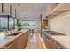 Spacious kitchen with stainless steel appliances, custom cabinets, and a view to the dining area at 6142 E Alta Hacienda Dr, Scottsdale, AZ 85251