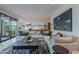 Bright living room showcasing a plush sectional sofa, kitchen and stylish decor at 6142 E Alta Hacienda Dr, Scottsdale, AZ 85251