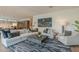 Bright living room boasting a plush sectional sofa, chic armchairs, and stylish decor at 6142 E Alta Hacienda Dr, Scottsdale, AZ 85251