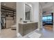 The stylish bathroom showcases a floating double vanity, walk-in closet, and glass shower at 6142 E Alta Hacienda Dr, Scottsdale, AZ 85251