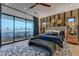 Main bedroom featuring a private balcony, stylish decor, and a calming color palette at 6142 E Alta Hacienda Dr, Scottsdale, AZ 85251