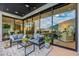This is a luxurious patio with ample seating, large sliding glass doors, and views of a mountain at 6142 E Alta Hacienda Dr, Scottsdale, AZ 85251