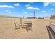 Backyard featuring a fire pit, trampoline, and low maintenance desert landscaping at 633 S 96Th St, Mesa, AZ 85208