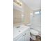 Bright bathroom featuring a white vanity, toilet, and shower-tub combination at 633 S 96Th St, Mesa, AZ 85208