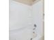 Clean bathroom showcasing a shower-tub combo with built-in shelving and a chrome shower head at 633 S 96Th St, Mesa, AZ 85208