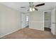 Bedroom featuring neutral walls, carpet and a lighted ceiling fan at 633 S 96Th St, Mesa, AZ 85208