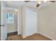 Neutral bedroom featuring a closet and access to another room with light streaming in from the window at 633 S 96Th St, Mesa, AZ 85208