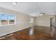 The living room is large, bright, and has hardwood flooring throughout the space at 633 S 96Th St, Mesa, AZ 85208