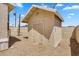 A backyard shed with vertical wooden siding and a peaked roof sits on a gravel-covered lot at 633 S 96Th St, Mesa, AZ 85208