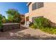 The paver patio shows a hot tub, grill, and colorful plants for a relaxing outdoor living space at 6459 E Sugarloaf St, Mesa, AZ 85215