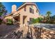 Backyard view of the home featuring a hot tub, grill, and desert landscaping at 6459 E Sugarloaf St, Mesa, AZ 85215