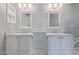 Beautiful bathroom featuring double sinks, marble countertops, and elegant white cabinetry at 6459 E Sugarloaf St, Mesa, AZ 85215