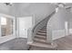 Grand foyer with a staircase, neutral colors, and stylish tile flooring, perfect for welcoming guests into the home at 6459 E Sugarloaf St, Mesa, AZ 85215