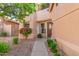 Inviting front entrance featuring a stylish front door, manicured landscaping, and a walkway leading to the entrance at 6459 E Sugarloaf St, Mesa, AZ 85215