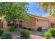 Charming home with a cozy front porch, mature landscaping, and a well-maintained exterior, ready for new owners at 6459 E Sugarloaf St, Mesa, AZ 85215