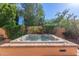 Backyard hot tub with lush landscaping provides ultimate privacy and relaxation at 6459 E Sugarloaf St, Mesa, AZ 85215