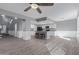 Spacious kitchen featuring white cabinets, gray island, and stainless appliances at 6459 E Sugarloaf St, Mesa, AZ 85215