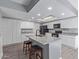 Bright, open kitchen with new countertops, stainless appliances, and island at 6459 E Sugarloaf St, Mesa, AZ 85215