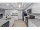Kitchen with granite countertops, stainless appliances, and wood-look flooring at 6459 E Sugarloaf St, Mesa, AZ 85215
