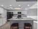Bright, open kitchen with granite countertops, stainless appliances, and island at 6459 E Sugarloaf St, Mesa, AZ 85215