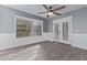 Bright living room featuring plank flooring, stylish trim, and french doors at 6459 E Sugarloaf St, Mesa, AZ 85215