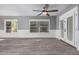 Bright living room featuring plank flooring, stylish trim, and backyard views at 6459 E Sugarloaf St, Mesa, AZ 85215