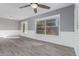 Bright living room featuring plank flooring, stylish trim, and views of backyard at 6459 E Sugarloaf St, Mesa, AZ 85215