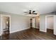 Spacious bedroom features wood-look flooring and a modern ceiling fan at 6743 S Jentilly Ln, Tempe, AZ 85283