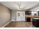 The dining area boasts wood-look tile flooring and access to the outdoor patio at 6743 S Jentilly Ln, Tempe, AZ 85283
