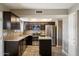 Updated kitchen featuring stainless appliances, granite countertops, and stylish backsplash at 6743 S Jentilly Ln, Tempe, AZ 85283