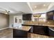 Well-appointed kitchen with a granite island, stainless steel appliances, and sleek cabinetry at 6743 S Jentilly Ln, Tempe, AZ 85283