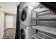 Conveniently located laundry area with stacked washer and dryer at 6743 S Jentilly Ln, Tempe, AZ 85283