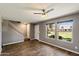Bright living area with large windows, wood-look flooring and staircase at 6743 S Jentilly Ln, Tempe, AZ 85283