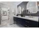 Modern bathroom with a double vanity, marble countertop, and stylish decor at 7710 N Via De Fonda St, Scottsdale, AZ 85258