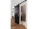 Bathroom with a barn door entry featuring a modern tile design and a vanity at 7710 N Via De Fonda St, Scottsdale, AZ 85258