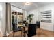 Modern dining area with glass table, backyard access, and stylish artwork at 7710 N Via De Fonda St, Scottsdale, AZ 85258