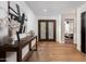Bright and airy foyer featuring beautiful hardwood floors and stylish decor at 7710 N Via De Fonda St, Scottsdale, AZ 85258